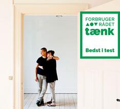 Dette realkreditlån er Bedst i Test - logo og par i nyt hjem