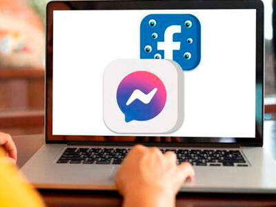 Person bruger sin computer til Facebook og Messenger